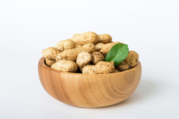 Fresh healthy peanuts in bowl on colored table background. Top view Healthy eating bertholletia concept. Super foods
