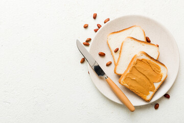 Peanut butter sandwiches or toasts on light table background.Breakfast. Vegetarian food. American cuisine top view vith copy space
