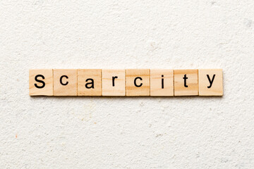 scarcity word written on wood block. scarcity text on cement table for your desing, concept