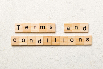 Terms and Conditions word written on wood block. Terms and Conditions text on table, concept