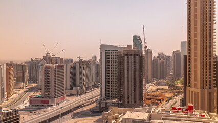 Skyscrapers at the Business Bay in Dubai aerial all day timelapse, United Arab Emirates