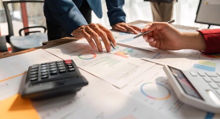 Business team analyzes financial business finance reports on laptop and graph documents during corporate meeting discussions showing successful teamwork, business meeting ideas