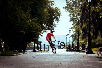 Ukrainian bmx rider performs tricks in the middle of the city.