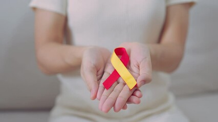 woman holding Red and Yellow ribbon. World hepatitis day awareness month, 28 July, Liver cancer, Jaundice, Cirrhosis, Failure, Enlarged, Hepatic Encephalopathy and Health concept
