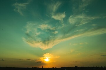 Colorful sky at sunset with powerful cumulus clouds, Ukrainian landscape