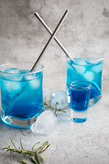 A glass of cocktail, Blue Lagoon. cool. on a gray background