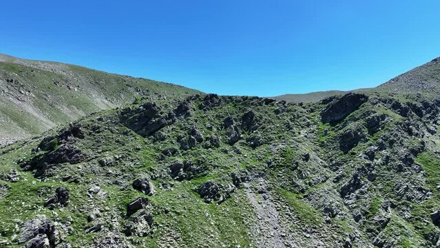 Horizontal drone shot of a mountain peak in Mercantour national park