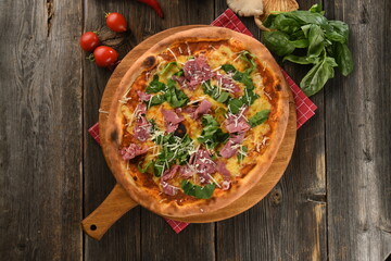 Delicious crispy edge brisket meat pizza with basil 