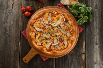 Delicious crispy edge sooty sea bass pizza with vegetables
