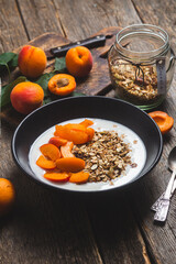 Granola with yogurt and apricots in a bowl