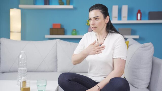 Sick woman with rapid breathing. The woman cannot control her breathing.