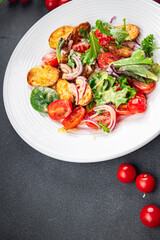 potato salad and vegetable baked potato, tomato, onion, salad leaves, salad dressing vinaigrette vegetables food healthy meal food snack on the table copy space food background rustic top view 
