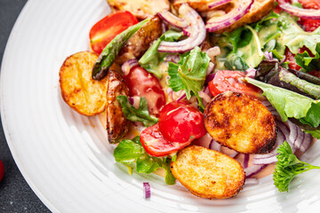 potato salad and vegetable baked potato, tomato, onion, salad leaves, salad dressing vinaigrette vegetables food healthy meal food snack on the table copy space food background rustic top view 