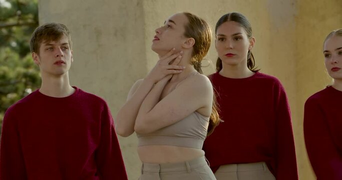 Professional dancing group performing an interpretive dance, choreography, 4k