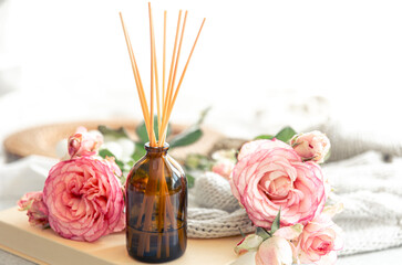 Obraz na płótnie Canvas Spa composition with incense sticks and pink flowers.