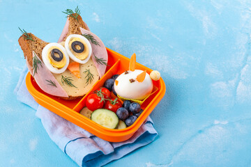 Funny owl sandwich with cheese and ham and egg in shape of rabbit. School lunch box for kids. Top...