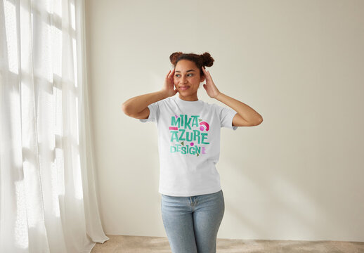 Mockup of woman wearing customizable color t-shirt, hands touching head