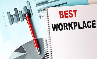 BEST WORKPLACE text on a notebook with pen on a chart background