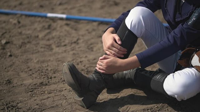 the girl fell. a close-up of the injury the girl received. teenagers jump over obstacles. Horseback riding. equestrian sports.slow motion video.Full HD video recording