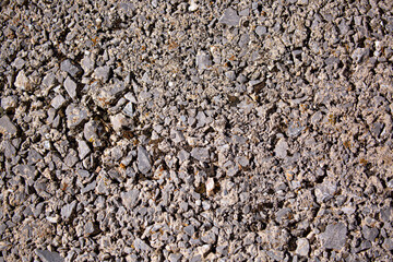 Stone antique old wall as a background or texture. Vintage background of a fortress wall in loft and grunge style with place for text and copy space.