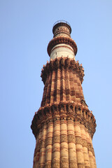 Fototapeta na wymiar Qutb Minar or Qutub Minar or Qutab is a 73 metre minaret tower at Qutub Complex known as Unesco World Heritage Site, Qutub Minar - the tallest minaret in New Delhi, India, Asia