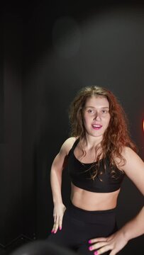 female running on elliptical orbitrek machine in fitness gym. Slow motion