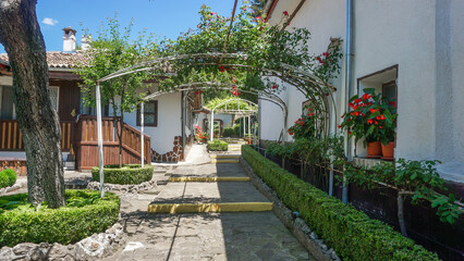 Fototapeta premium 02_The beautiful inner courtyard of the Beautiful Monastery St. Nicholas the Wonderworker, village of Arbanassi, region Veliko Tarnovo, Bulgaria. 