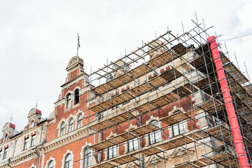 Restoration of the facade of the house of an old building in the city.