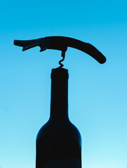 bottle of wine and corkscrew