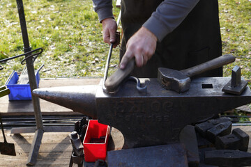 handwork and glowing coals and iron