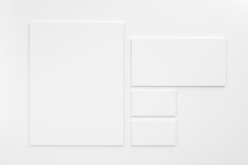 White blank stationery mock-up template on white background. Envelope, business cards and A4 paper.