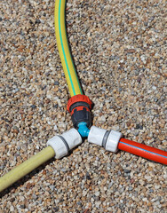 Sprinkler pipe outdoor on gravel