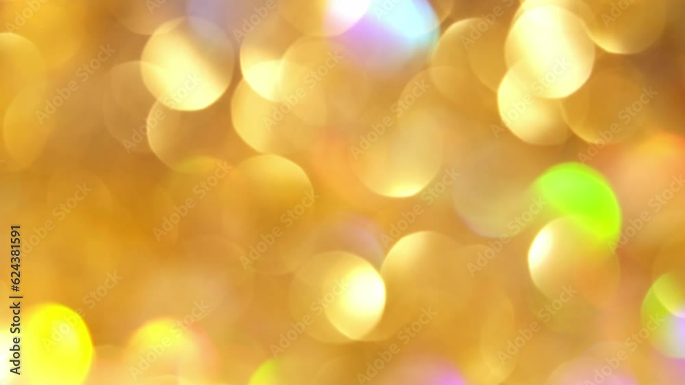 Wall mural a natural effect of shimmering gold bokeh lights. blurred glitter sparkling circles motion. bright a