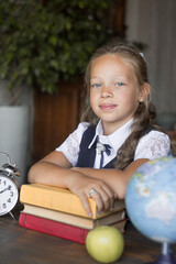 Portrait primary schoolgirl, in school uniform.