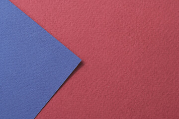 Fototapeta na wymiar Rough kraft paper background, paper texture red burgundy blue colors. Mockup with copy space for text.