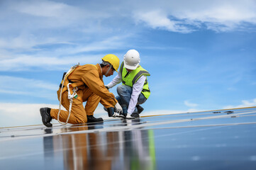 Technician Inspector Quality in Solar Roof Panel Installation with Installer, Quality Control Re-Check in Work of Sustainable Photovoltaic Installation on Factory Roof Buildings.