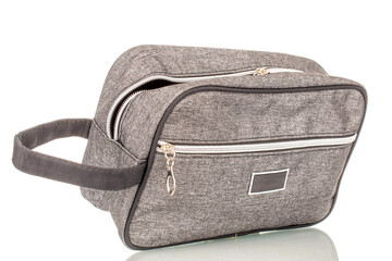 One man's cosmetic bag, macro, isolated on white background.
