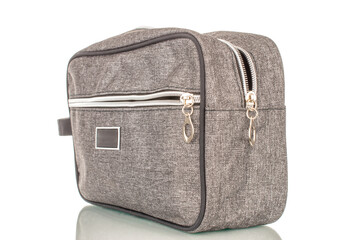 One man's cosmetic bag, macro, isolated on white background.