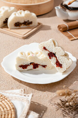 Baozi or Bakpao is a type of yeast-leavened filled bun in various Chinese cuisines.