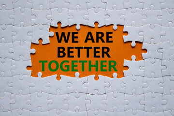 We are better together symbol. White puzzle with words We are better together. Beautiful orange...