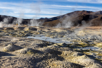 Stunning geothermic field of Sol de Mañana with its steaming geysers and hot pools with bubbling mud - just one sight on the lagoon route in Bolivia, South America