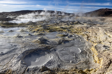 Stunning geothermic field of Sol de Mañana with its steaming geysers and hot pools with bubbling mud - just one sight on the lagoon route in Bolivia, South America