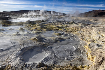 Stunning geothermic field of Sol de Mañana with its steaming geysers and hot pools with bubbling mud - just one sight on the lagoon route in Bolivia, South America