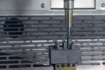 The CNC milling machine rough cutting the graphite electrode parts with solid flat end mill.