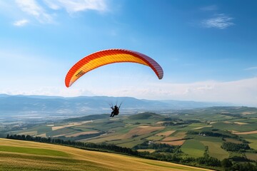 Paraglider drifting over countryside landscape with blue sky, created using generative ai technology