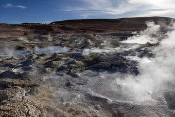 Stunning geothermic field of Sol de Mañana with its steaming geysers and hot pools with bubbling mud - just one sight on the lagoon route in Bolivia, South America