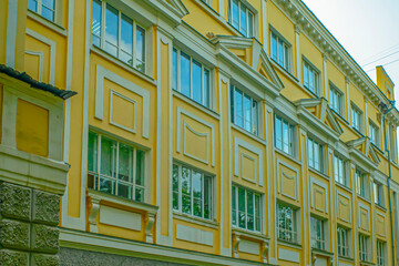 Fragment of the facade of a historic building on a summer day
