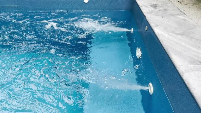 The air bubbles from the swimming pool are the water circulating system within the pool.