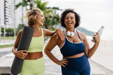 Healthy friends enjoying outdoor beach workout together
