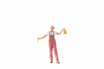 Miniature people, painter holding paint brush isolated on white background with clipping path